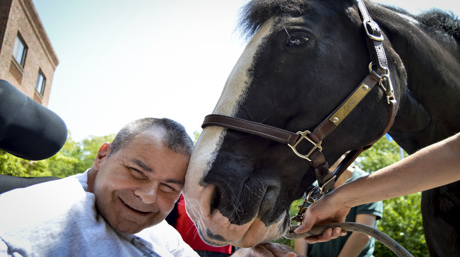 Happy resident meets horse